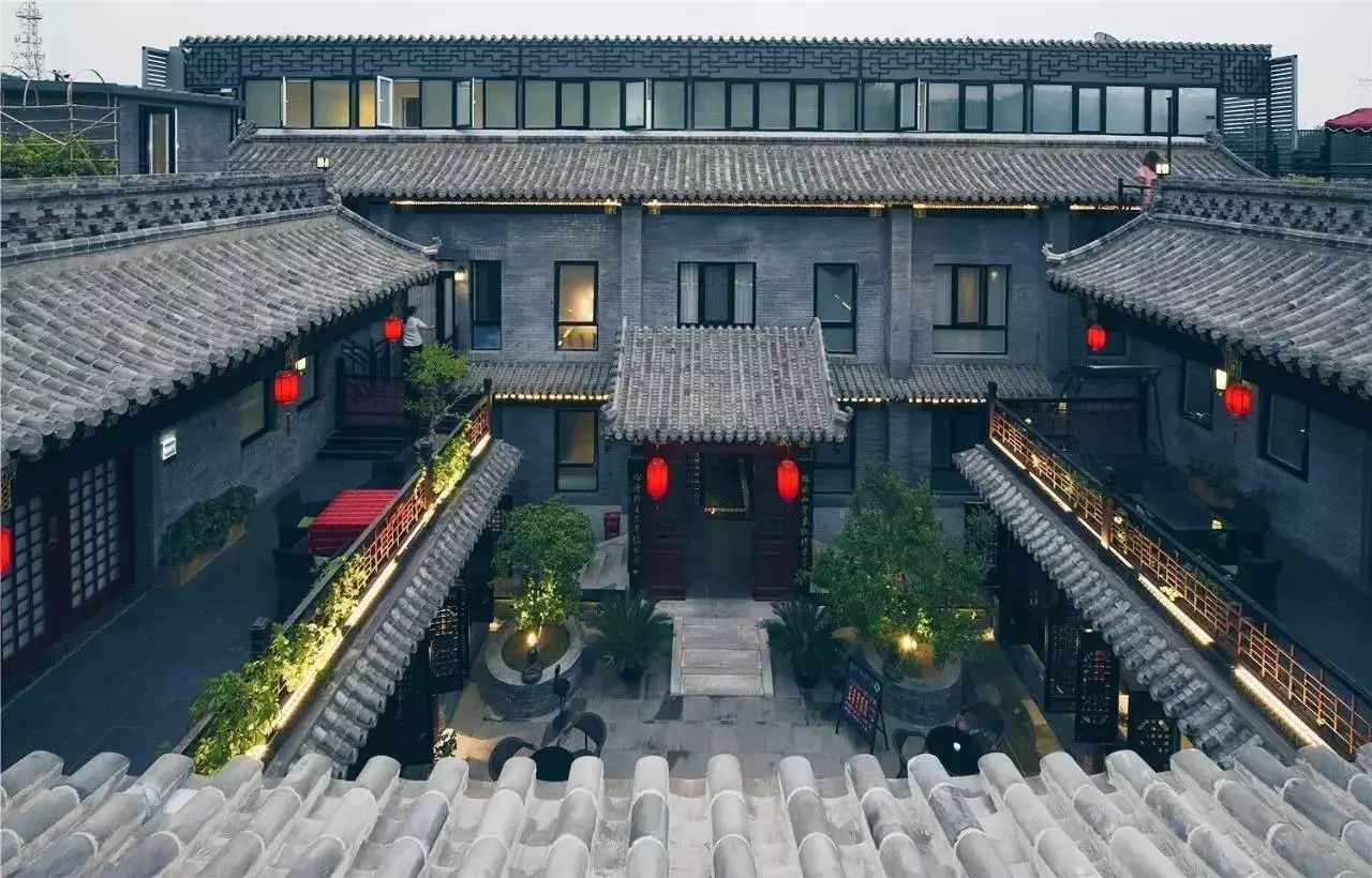 Traditional Qing-dynasty courtyard in Kuanzhai Alley with bamboo garden and carved wooden doorways